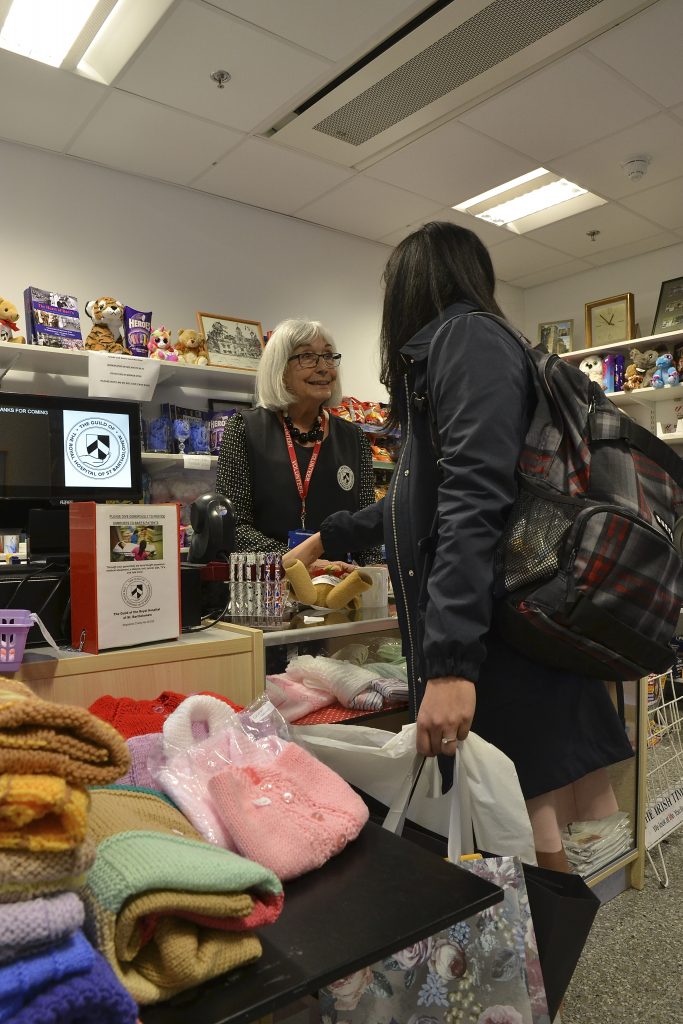 Serving customers in the Guild Shop